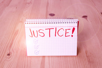 Handwriting text writing Justice. Conceptual photo impartial adjustment of conflicting claims or assignments Empty reminder wooden floor background spiral notebook groove slot office