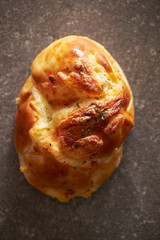 Cheese bread, dried parsley on top 