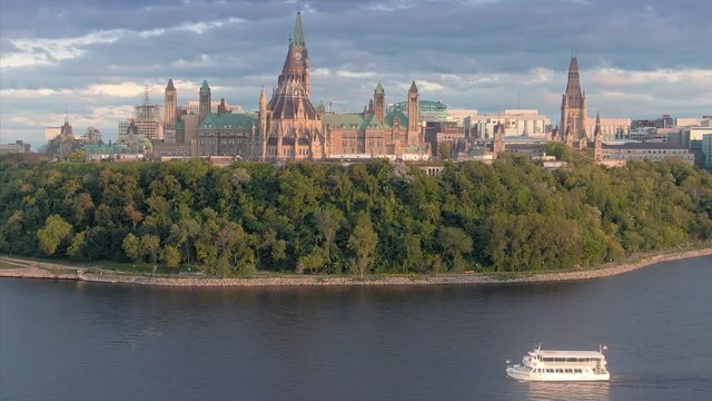 Ferry boat on the Ottawa River. In the background is the Library of Parliament on Parliament Hill. Ottawa, Ontario, Canada. 11 September 2019
