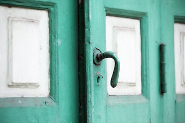close up of green vintage entrance door