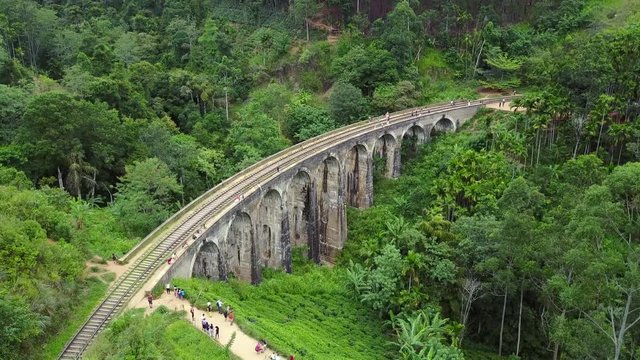 Aerial view of Nine Arches Bridge with ceylon tea plantation landscape, Famous tourist attraction in Ella, Sri Lanka. Travel South Asia. 4K Drone Video