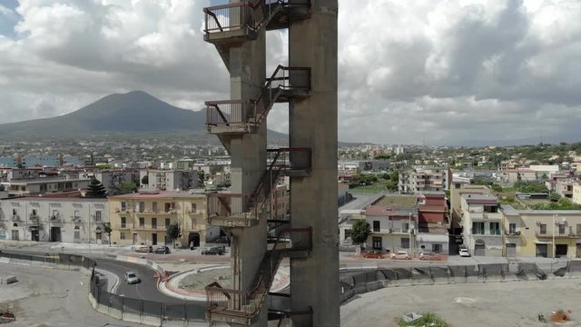 Abandoned tower, stairwell with mount Vesuvius in the background, Volcano and apocalypse, Aerial footage