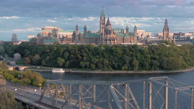 Aerial: Alexandria Bridge crossing the Ottawa River. In the background is the Library of Parliament. Ottawa, Ontario, Canada. 11 September 2019