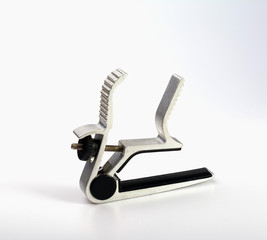 Capo clip for guitar strings isolate