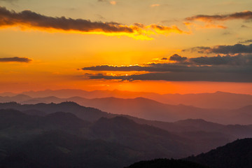 colorful clouds in sunset mountains