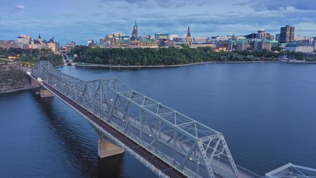 Aerial hyperlapse timelapse of Alexandria Bridge crossing the Ottawa River. In the background is the Library of Parliament. Ottawa, Ontario, Canada. 11 September 2019