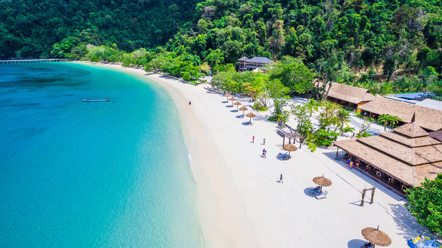 Aerial view of natural clear blue sea and white sand beach with umbrella, Andaman sea, South of Myanmar and Thailand, Top view from drone, Beautiful destination place Asia, Summer vacation travel trip