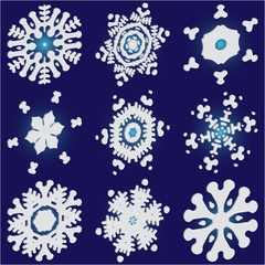 Collection of paper cut isolated snowflakes on blue background.