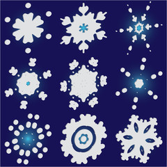 Set of christmas paper snowflakes on blue background.