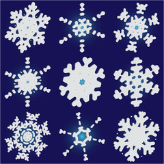 Collection of paper cut isolated snowflakes on blue background.