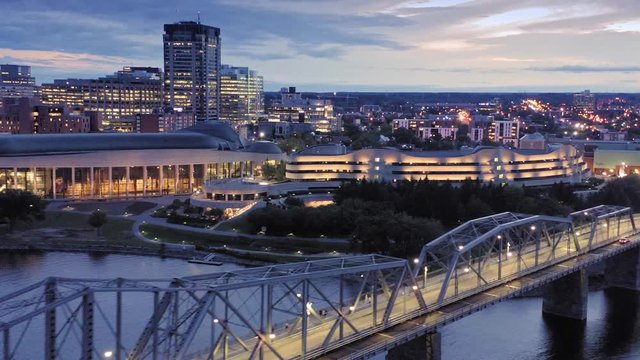Aerial: Alexandria bridge over the Ottawa River to Gatineau at night. Ottawa, Ontario, Canada.