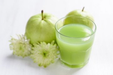 Green guava fruit and guava juice in glass, high vitamin C healthy drink