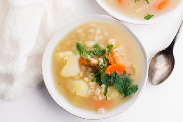 Barley soup, pearl barley in white bowl
