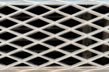 Close up of old metallic car grille, close up background.