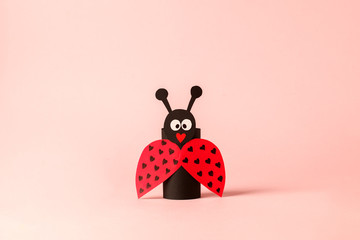 Paper ladybug for valentine, birthday, baby shower, daycare party. Easy craft for kids on blue...