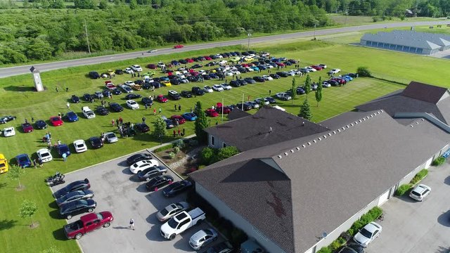 Outdoor Exotic Car Show Lots Of People Walking Around Aerial View