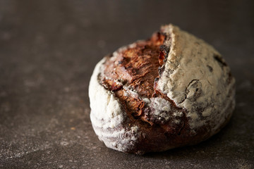Hard black color bread on stone background