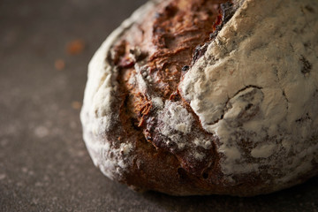 Hard black color bread on stone background