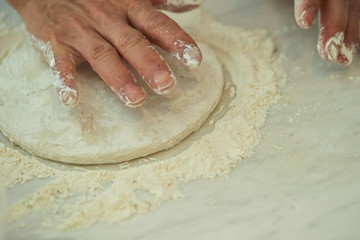 Kneading bread dough by hands