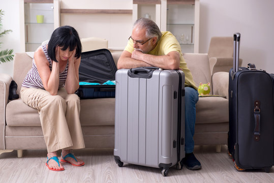 Old Couple Preparing For Vacation Travel