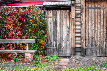 The faded gate of an old wooden house.