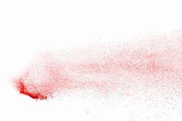 Explosion of red powder on black background