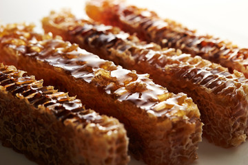 Honey comb on white background 