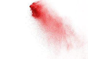 Explosion of red powder on black background