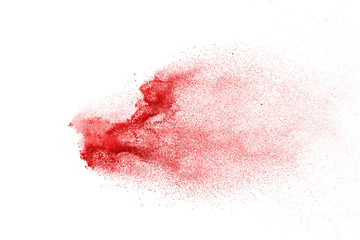 Explosion of red powder on black background