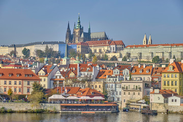 Obraz premium Scenic panorama with Prague Castle (Prazsky hrad) and Vlatva river in capital of Czech Republic Prague. Beautiful summer sunny cityscape of the biggest city of Czechia