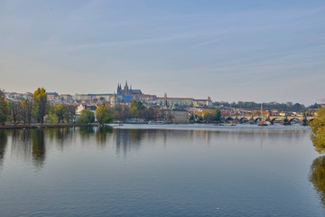 Fototapeta na wymiar Scenic panorama with Prague Castle (Prazsky hrad) and Vlatva river in capital of Czech Republic Prague. Beautiful summer sunny cityscape of the biggest city of Czechia