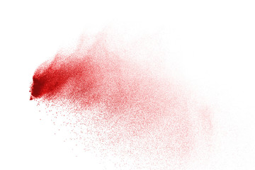 Explosion of red powder on black background