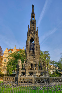 Scenic view of Kranner's Fountain (Krannerova kasna) in park of bank Vlatva river in capital of Czech Republic Prague. Beautiful sunset summer look of medieval fountain in ancient touristic town