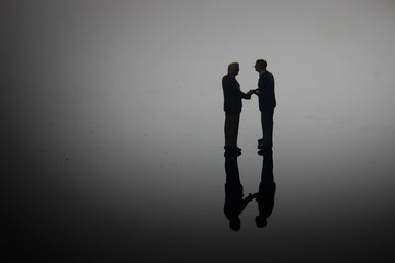 Dramatic Lighting, Simple Illustration Photo for Silhouette Two Miniature Figure Man Toy...