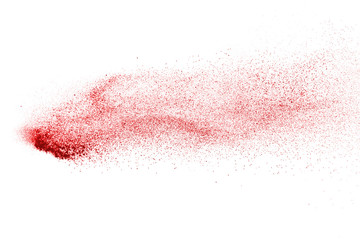 Explosion of red powder on black background