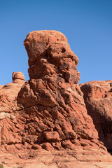 Fototapeta na wymiar Bearded man with a hat rock formation