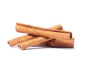 Dried cinnamon sticks close-up on a white background