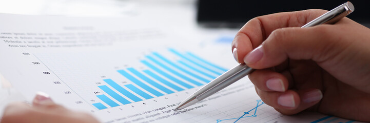 businesswoman study documents in office closeup