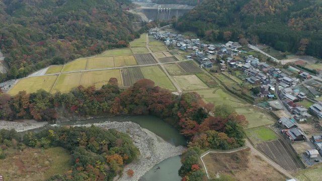 Eigenji Dam, Aerial reveal over rural Shiga village in Autumn. Japan 4k
