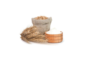  Wheat grain in a canvas bag with bread ears and flour on a white background