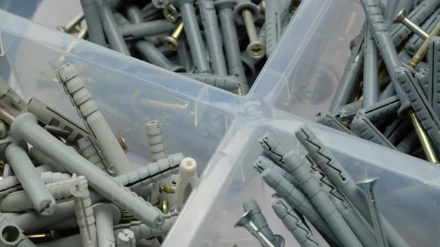 screws and dowels in a plastic box