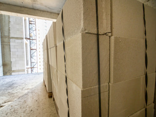 Packing aerated concrete blocks in a multi-storey building under construction