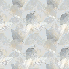 Seamless chaotic pattern with autumn leaves, light gray and beige background.
