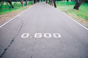 Obraz premium The number on the road, distance 0.60 m, is a number indicating the location.