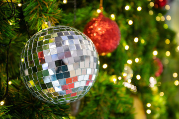 Christmas balls and lights decorating on pine tree