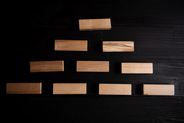 form for network marketing text. Wooden cubes laid out in the form of a pyramid