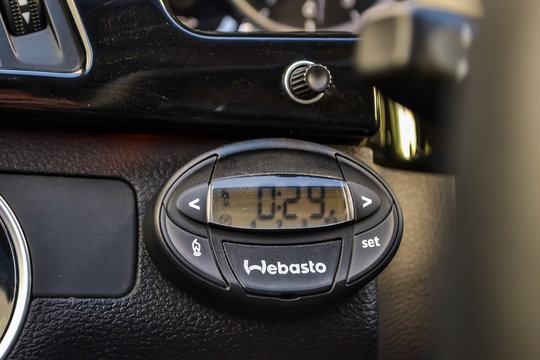 Webasto engine and passenger compartment heating control panel on a black car panel that is intended for use in the winter and warming the air.
