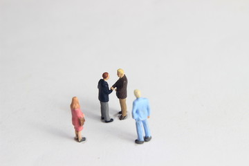 Gray Backgrond, Simple Illustration Photo for Mini Figure Two Man Toy Handshaking for Business...