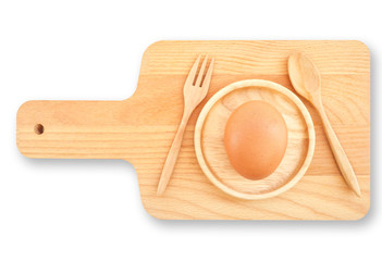 Isolated Wooden Kitchen Utensilsand food concept, Cutting chopping board, spoon, fork and chicken egg on small round dish saucer with white background-with clipping path (selective egg focus)