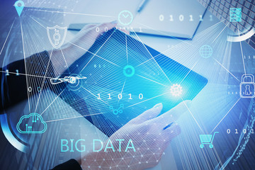 Woman with tablet using big data interface